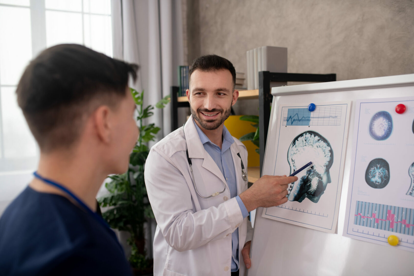 Bearded doctor explaining medical case details to his colleague